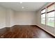Bright and airy living room with hardwood floors and large windows with custom blinds at 11188 Giddings Pl, Noblesville, IN 46060