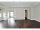 Bright living room featuring beautiful dark wood floors, neutral walls, and open layout at 11188 Giddings Pl, Noblesville, IN 46060