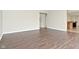 Open living room with hardwood floors leading to the kitchen at 11188 Giddings Pl, Noblesville, IN 46060