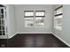 Brightly lit room featuring hardwood floors, large windows, and neutral walls at 11188 Giddings Pl, Noblesville, IN 46060