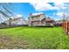 Large, grassy backyard and patio area at 11247 Reflection Point Dr, Fishers, IN 46037