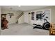 Finished basement area featuring a built-in bookcase, carpeting, and exercise equipment at 11247 Reflection Point Dr, Fishers, IN 46037