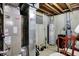 Unfinished basement featuring a Bryant HVAC system, water heater, and exposed piping at 11247 Reflection Point Dr, Fishers, IN 46037