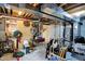 Unfinished basement showing exposed ductwork, wood paneling, and cluttered storage area at 11247 Reflection Point Dr, Fishers, IN 46037
