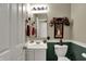 Half bathroom with white vanity, mirror, and decorative accents at 11247 Reflection Point Dr, Fishers, IN 46037