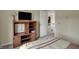 Bedroom with white walls, neutral carpet and a wooden entertainment center at 11247 Reflection Point Dr, Fishers, IN 46037