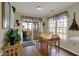 Cozy dining room with a wood table, slider door, and lots of natural light at 11247 Reflection Point Dr, Fishers, IN 46037