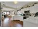 Well-lit kitchen featuring white cabinetry and modern stainless steel appliances at 11247 Reflection Point Dr, Fishers, IN 46037