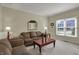 Cozy living room featuring comfortable seating, natural light, and a decorative mirror at 11247 Reflection Point Dr, Fishers, IN 46037
