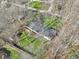 Bird's-eye view captures a home partially shaded by trees on a grassy lot, adding to its appeal at 11921 Westwood Dr, Carmel, IN 46033