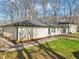 Lovely backyard with a paved patio and well-maintained lawn at 11921 Westwood Dr, Carmel, IN 46033