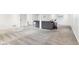 Expansive basement area with neutral carpeting, seating, and bright, white walls at 11921 Westwood Dr, Carmel, IN 46033