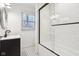 Modern bathroom features black vanity, shower-tub, and patterned tile floor at 11921 Westwood Dr, Carmel, IN 46033
