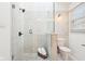Tiled shower with glass enclosure with modern fixtures and natural light at 11921 Westwood Dr, Carmel, IN 46033