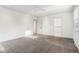 Bright bedroom featuring neutral carpet and ceiling fan; ample natural light at 11921 Westwood Dr, Carmel, IN 46033