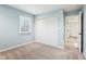 Charming bedroom features blue walls, carpet, window, and closet at 11921 Westwood Dr, Carmel, IN 46033