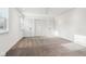 Spacious bedroom with neutral carpet, ceiling fan, and bright natural light at 11921 Westwood Dr, Carmel, IN 46033
