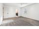 Bedroom with plush carpet, neutral walls, and a view into the ensuite bathroom at 11921 Westwood Dr, Carmel, IN 46033