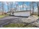 Long driveway leads to a three car garage and well-kept home at 11921 Westwood Dr, Carmel, IN 46033