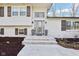 Inviting front entrance with a modern glass door and decorative planters at 11921 Westwood Dr, Carmel, IN 46033