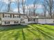 Well-maintained home with a pristine lawn and inviting entrance at 11921 Westwood Dr, Carmel, IN 46033