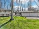 Traditional home with a well-kept lawn and ample parking at 11921 Westwood Dr, Carmel, IN 46033