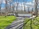Expansive home features a long driveway and manicured lawn at 11921 Westwood Dr, Carmel, IN 46033