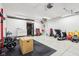 Garage featuring home gym equipment and ample storage space at 11921 Westwood Dr, Carmel, IN 46033