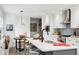 Modern kitchen featuring a large island with seating, stainless steel appliances, and open design at 11921 Westwood Dr, Carmel, IN 46033