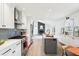 Elegant kitchen features stainless steel appliances, gray backsplash, white cabinets, and a seamless open layout at 11921 Westwood Dr, Carmel, IN 46033