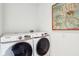 Modern laundry room featuring new Samsung washer and dryer at 11921 Westwood Dr, Carmel, IN 46033