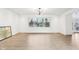 Spacious living room with natural light and wood floors at 11921 Westwood Dr, Carmel, IN 46033