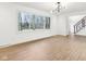 Bright living room with modern lighting, and staircase at 11921 Westwood Dr, Carmel, IN 46033