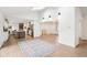 Open-concept living area with view of kitchen featuring island and stainless steel appliances at 11921 Westwood Dr, Carmel, IN 46033