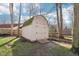 Outbuilding sits next to split rail fence under blue skies at 11921 Westwood Dr, Carmel, IN 46033