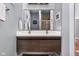 Bathroom vanity with double sinks, and a framed mirror above at 1230 N Temple Ave, Indianapolis, IN 46201