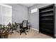 Bright office space with a desk, chair, and bookshelf, perfect for remote work at 1230 N Temple Ave, Indianapolis, IN 46201