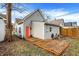 Backyard showcasing wood deck and gray siding with a red door at 1337 Linden St, Indianapolis, IN 46203