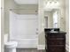 This bathroom is equipped with a shower-tub combo, toilet, and vanity, creating a practical and clean space at 1337 Linden St, Indianapolis, IN 46203