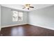 Comfortable bedroom with neutral paint, hardwood floors, and a window for plenty of natural light at 1337 Linden St, Indianapolis, IN 46203