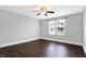 This bright bedroom boasts dark wood floors and large windows, offering plenty of natural light at 1337 Linden St, Indianapolis, IN 46203