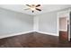This bedroom features sleek, dark wood floors, light blue walls, and an overhead ceiling fan for added comfort at 1337 Linden St, Indianapolis, IN 46203