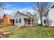 Charming exterior view of home featuring landscaped front yard and porch at 1337 Linden St, Indianapolis, IN 46203