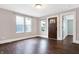 Bright living room with a decorative front door, wood flooring and white trim at 1337 Linden St, Indianapolis, IN 46203