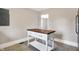 Spacious room featuring light colored walls, dark wood floors and white trim at 1337 Linden St, Indianapolis, IN 46203