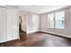 Spacious living room with hardwood floors, natural light, and convenient access to the kitchen and a closet at 1337 Linden St, Indianapolis, IN 46203