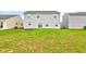 Spacious backyard with a view of the property and adjacent homes at 13872 N Mardenis W Dr, Camby, IN 46113
