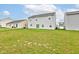 Expansive backyard featuring lush green grass, with neighboring houses at 13872 N Mardenis W Dr, Camby, IN 46113