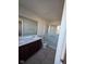 Bathroom featuring a double sink vanity, tiled floors, and a glass-enclosed shower at 13872 N Mardenis W Dr, Camby, IN 46113