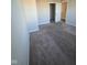 Comfortable bedroom featuring neutral walls, plush carpet, and an open closet, offering great storage at 13872 N Mardenis W Dr, Camby, IN 46113